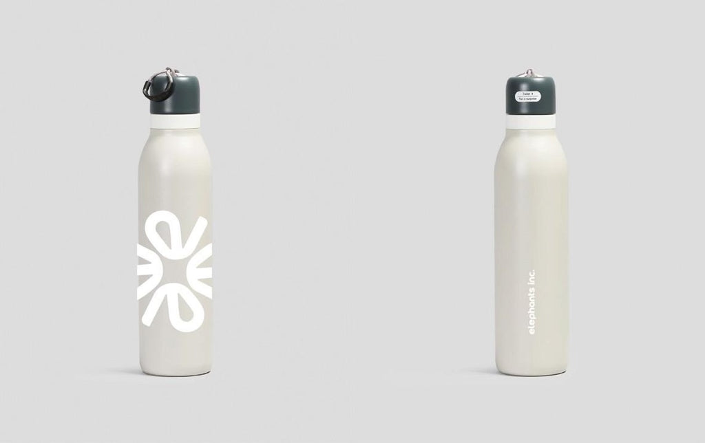 Two white water bottles with black lids on a light gray background