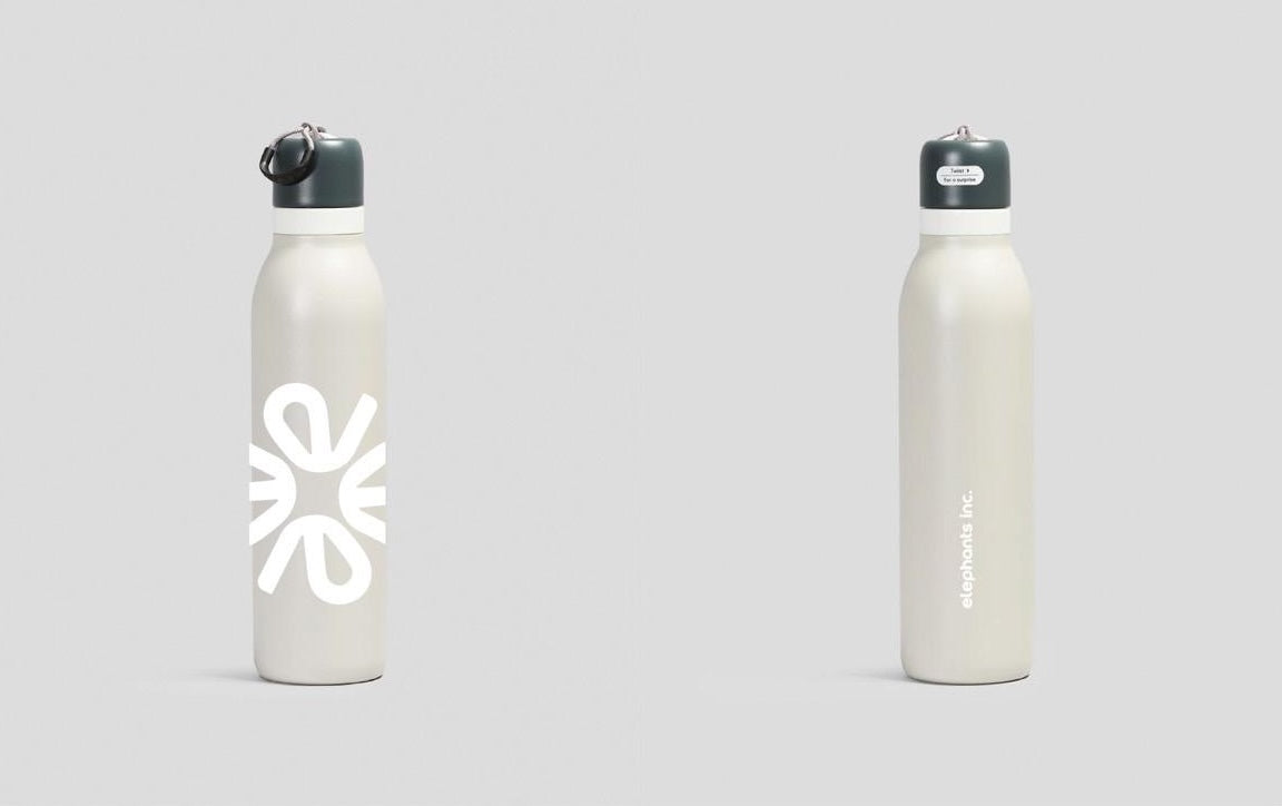 Two white water bottles with black lids on a light gray background