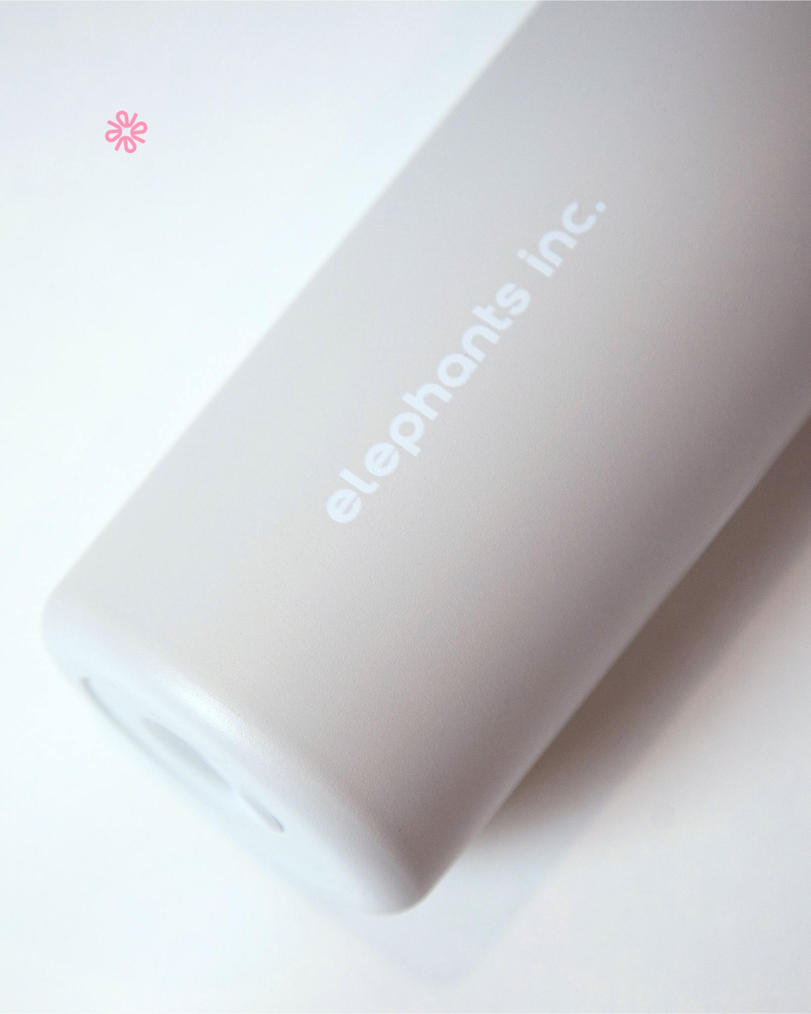 Pink power bank with 'elephants inc.' branding on a white background